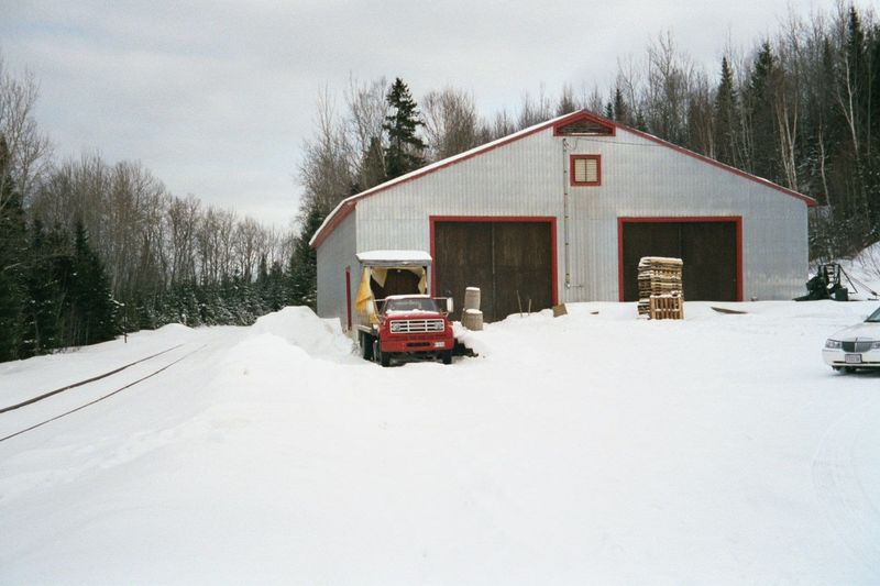 A newer-model potato house. The railway is the Bangor and Aroostook, and there is a siding that serves the side door on the potato house. St