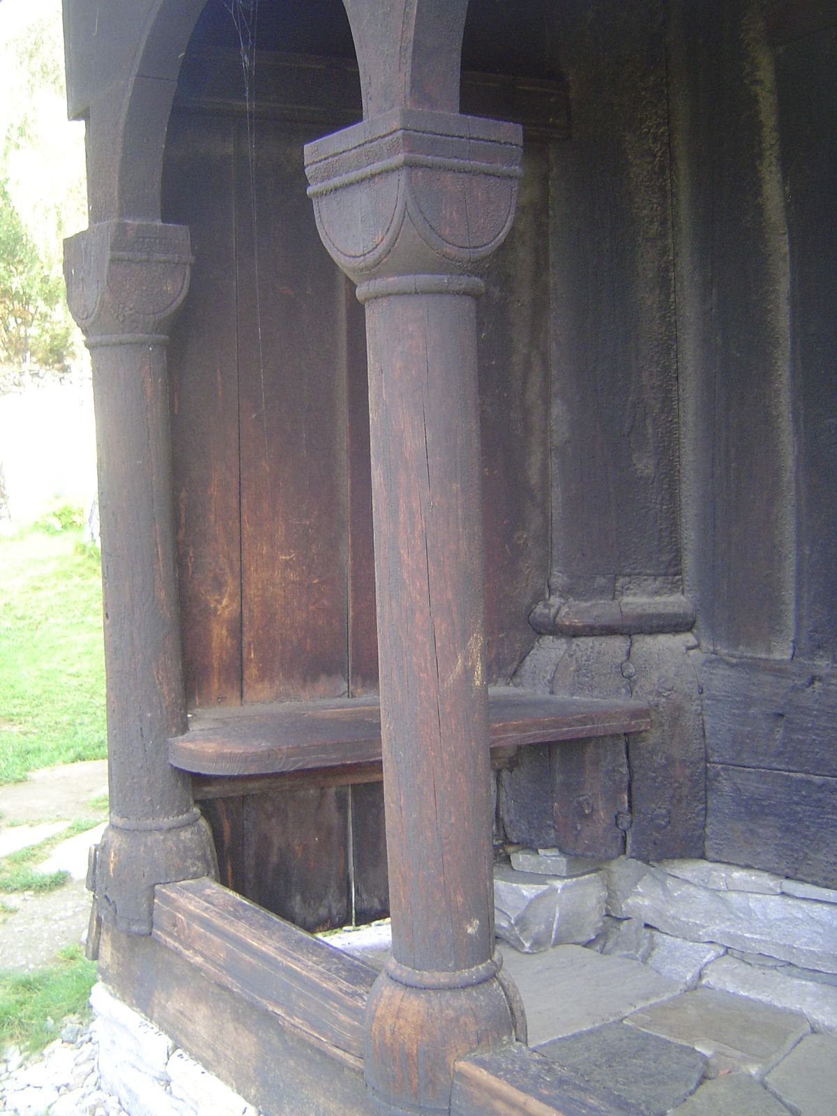 The entrance porch is supported by block capitals.