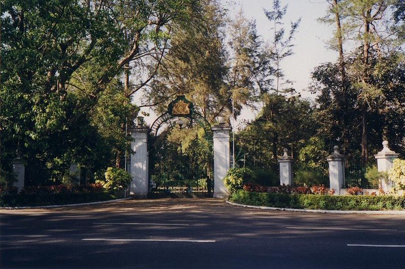 Off at the northwest corner of the old city, in the leafy suburbs of Ahlone, a still majestic side gate leads to the old Government House. M