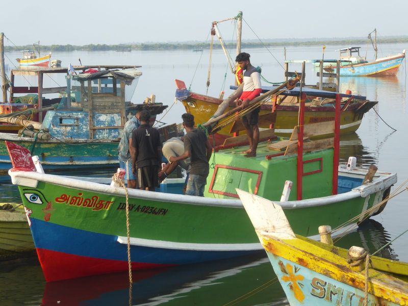 Here's a boat with an inboard engine and a boom in apparent need of attention.