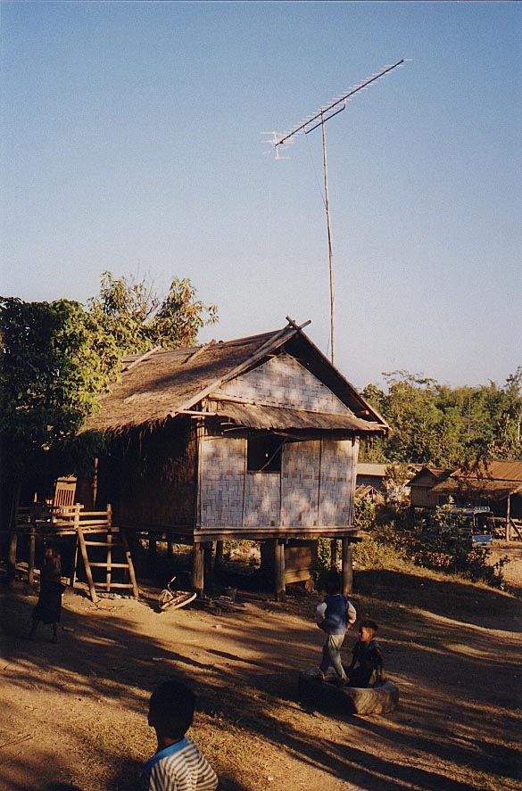 The house is entirely of traditional materials, but an antenna imports foreign ideas.