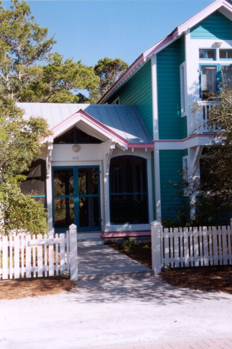Other houses hunker in the trees. Lawns are forbidden, according to the dictates of political ecology.