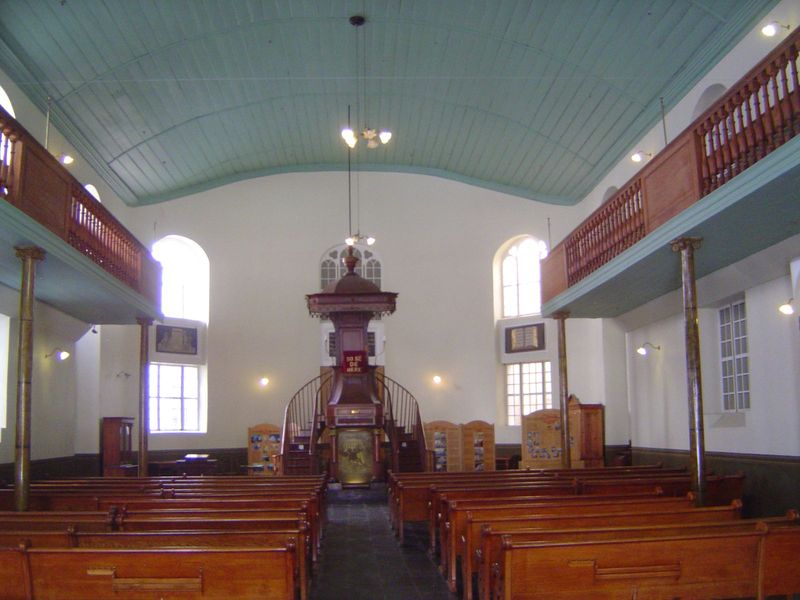 The interior, with a pulpit from 1824, looks a great deal like the Lutheran church. Do we have a case of copycatting? The balcony-support co
