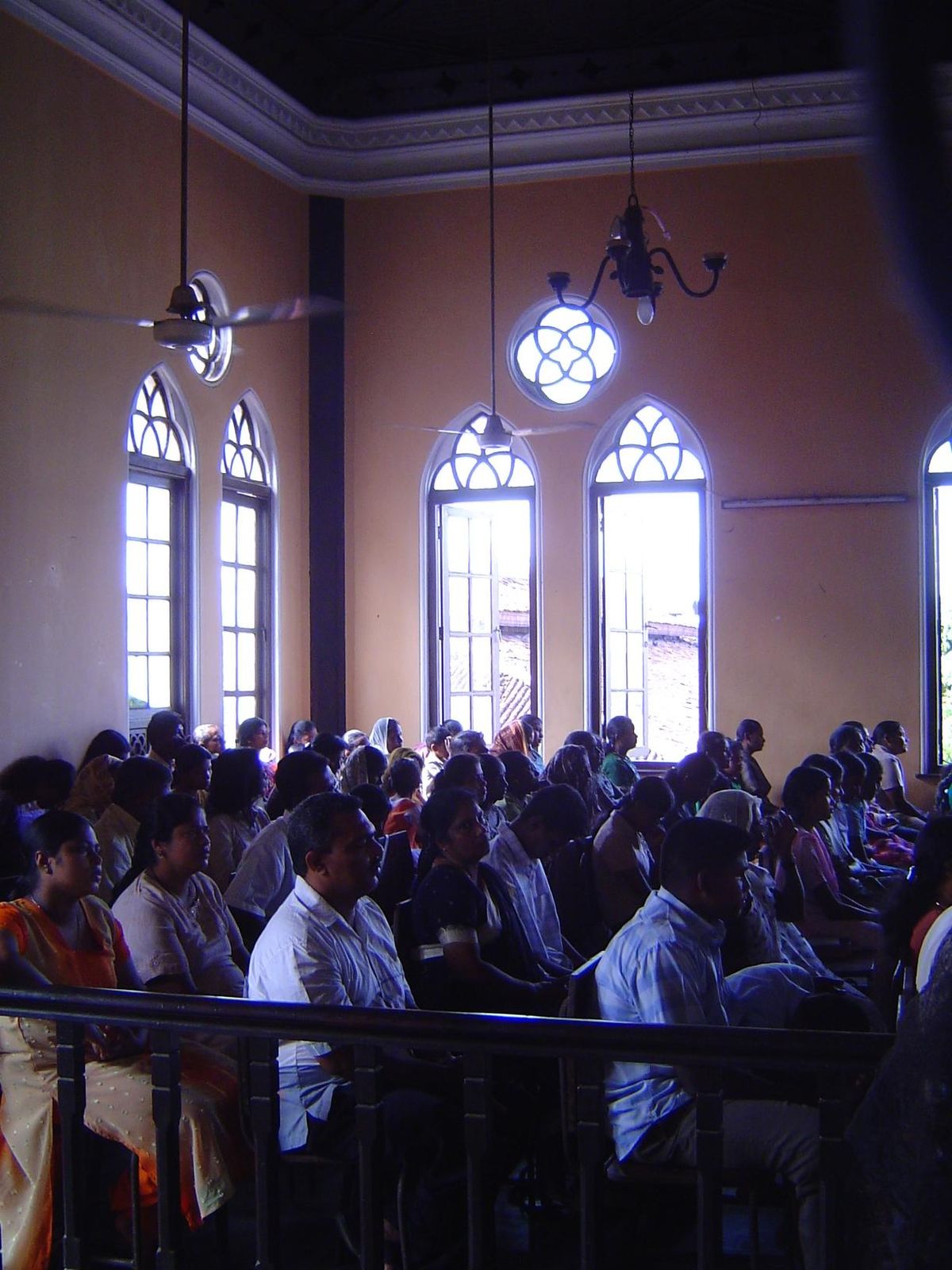 Upstairs in the old town hall, an evangelical Christian service is far more crowded than anything in the nearby Catholic churches.