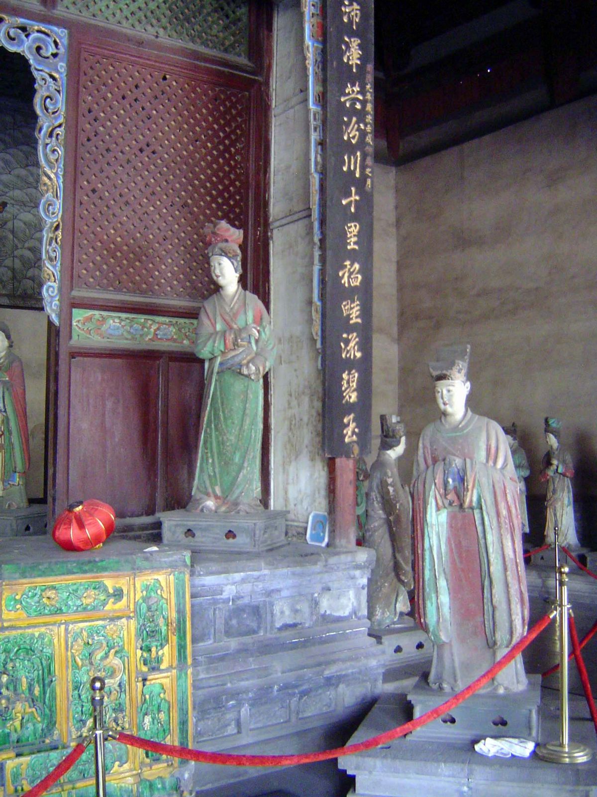 The sage goddess is surrounded by other clay figures, mostly contemporary with her but a few including the one of the left here from the muc