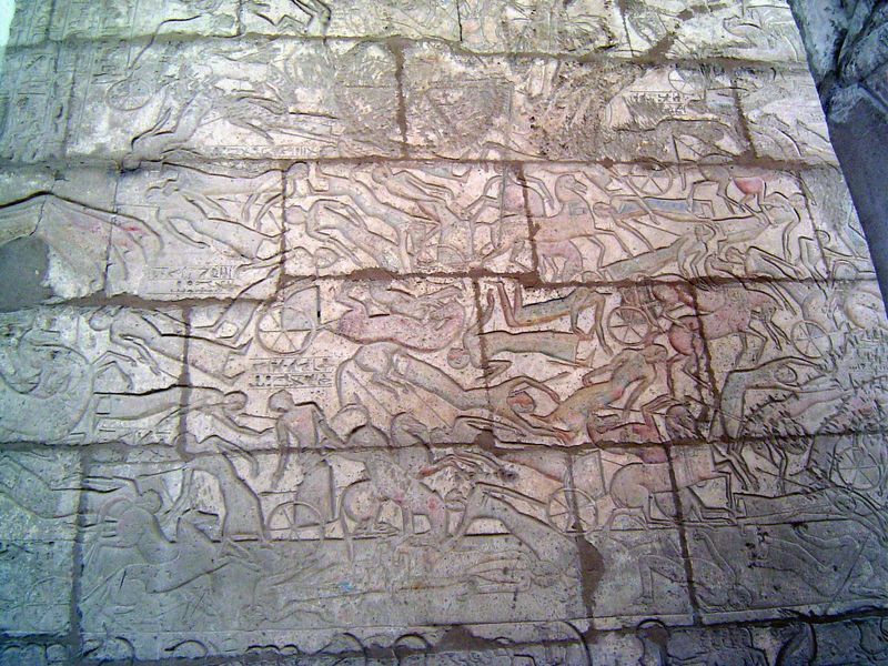 Here, on the back side of the second pylon, Rameses II devastates the Hittite Army. Traces of blue indicate the Orontes River, where the bat