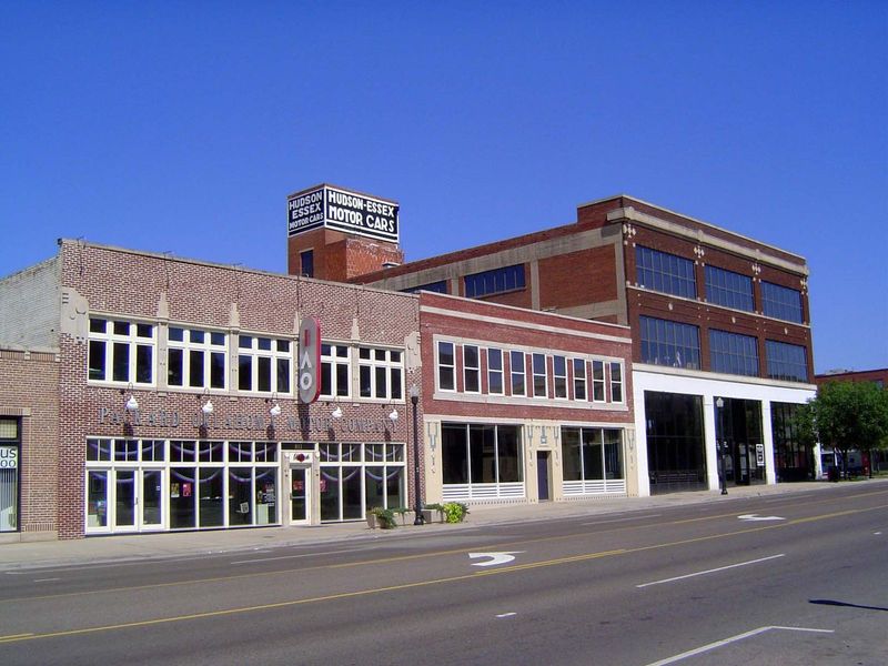 On the left was a Packard and Stutz dealer in 1920; in the middle was Norris Olds in 1917 but a Chevy dealership in the 1940s; on the right,