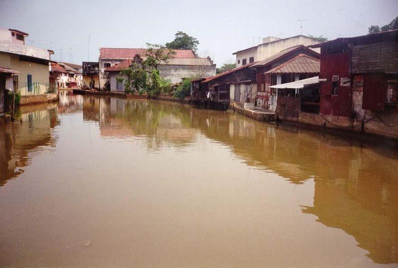 Across the street from that Dutch fort, the Melaka River drifts lazily along.