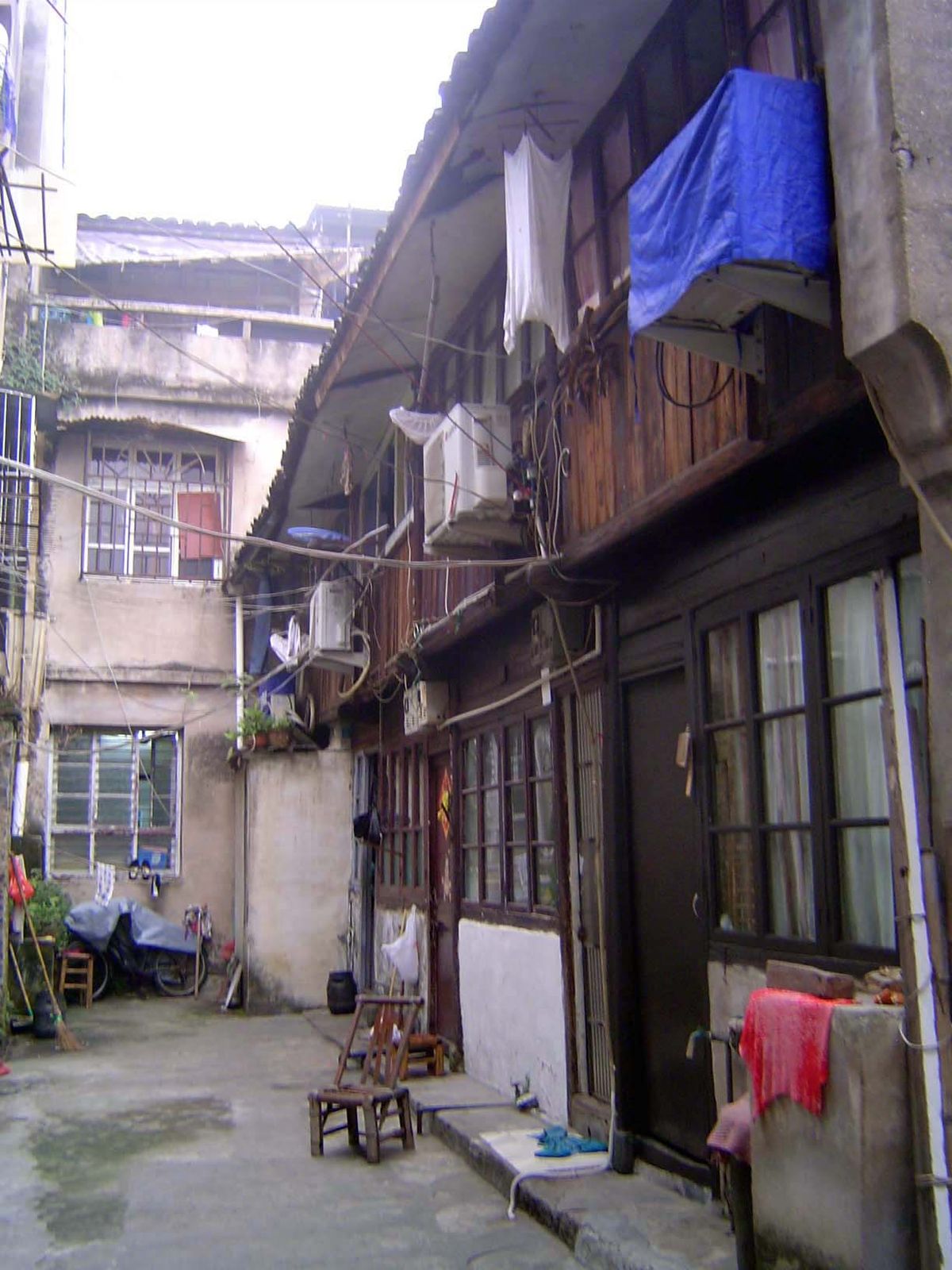 Houses of wood, glass, and plaster over... brick, perhaps?