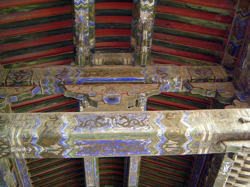 Rafters of the Hall of Mental Cultivation. This polychrome painting, though faded, is in that most prestigious style, called he xi. Each bea