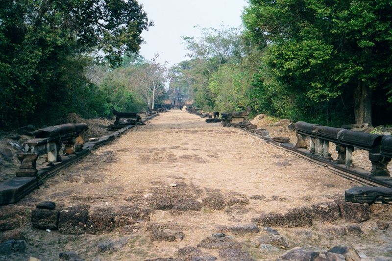 We've moved east about three miles and are looking west on the causeway that leads to Banteay Samre. You recognize the naga balustrade. Ahea