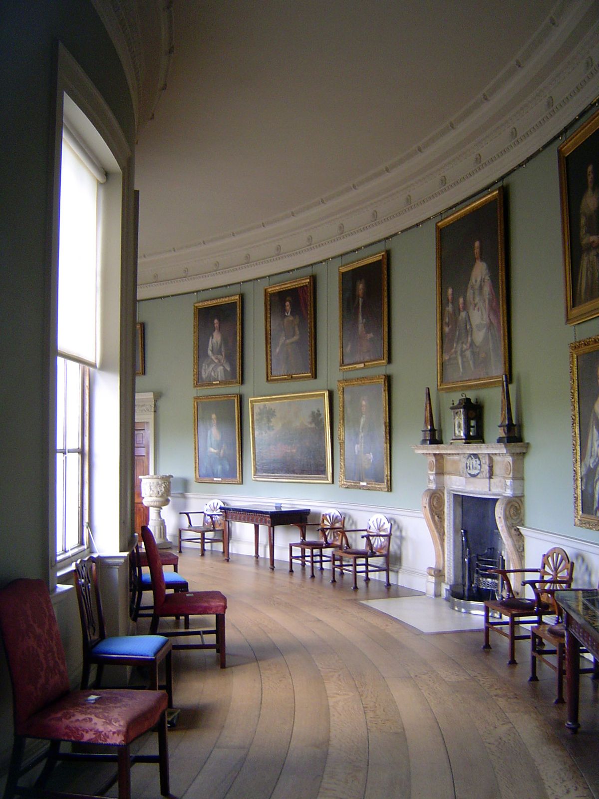 Although now converted into a portrait gallery, this was originally the Tapestry Corridor, curving toward the family wing and perhaps most r