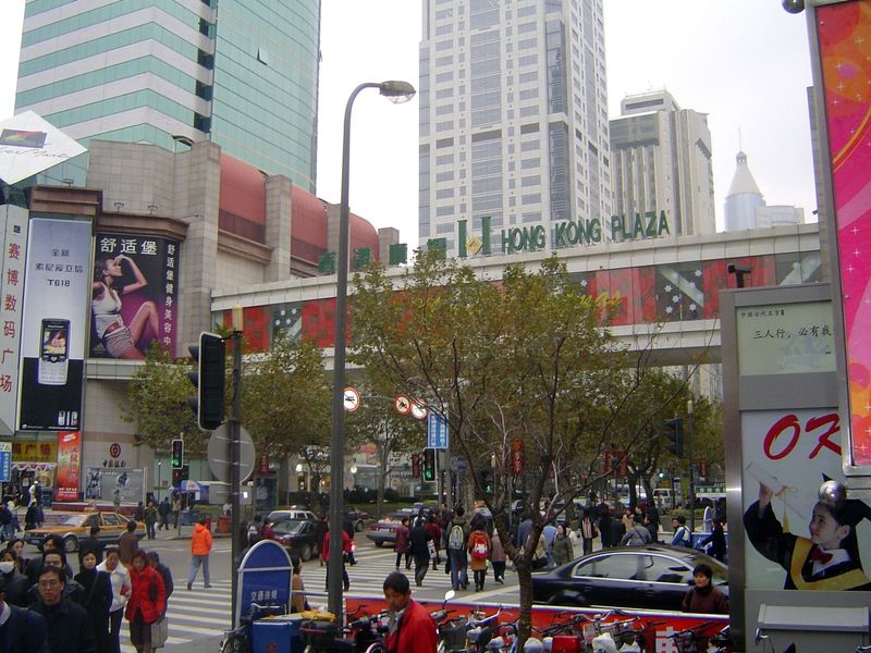 Streetside, busy shoppers.