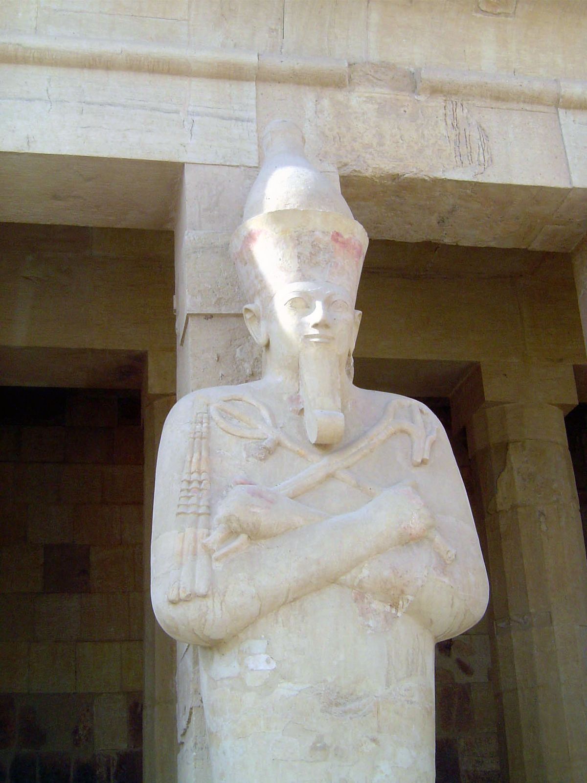 Osiris, as usual, appears holding a crook and flail, agricultural implements perhaps associated with the god's original character as a ferti