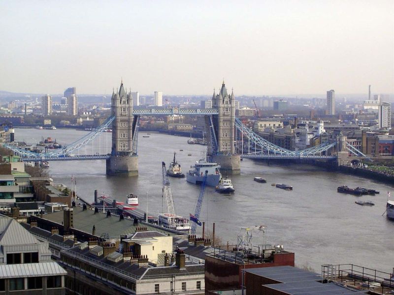 We start here at the Tower Bridge, seen with its twin bascules raised. The bridge opened in 1894 to relieve traffic on London Bridge, which 