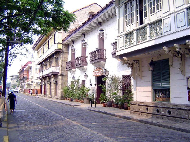 San Agustin is off to the left in this view of the historic main street of Intramuros, the Calle Real, now General Luna. On the right is the