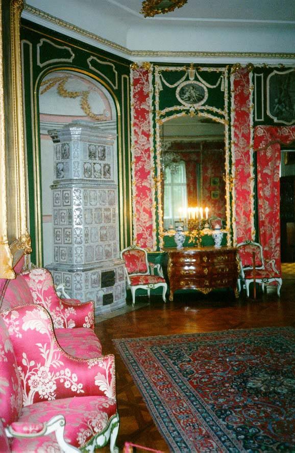 Inside, a tiled oven occupies a corner with an elegance that makes a fireplace seem uncouth.