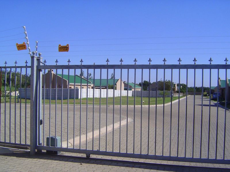 Here's another security-conscious subdivision. What do you make of the concrete-slab yard fences? The bright side is you never have to paint
