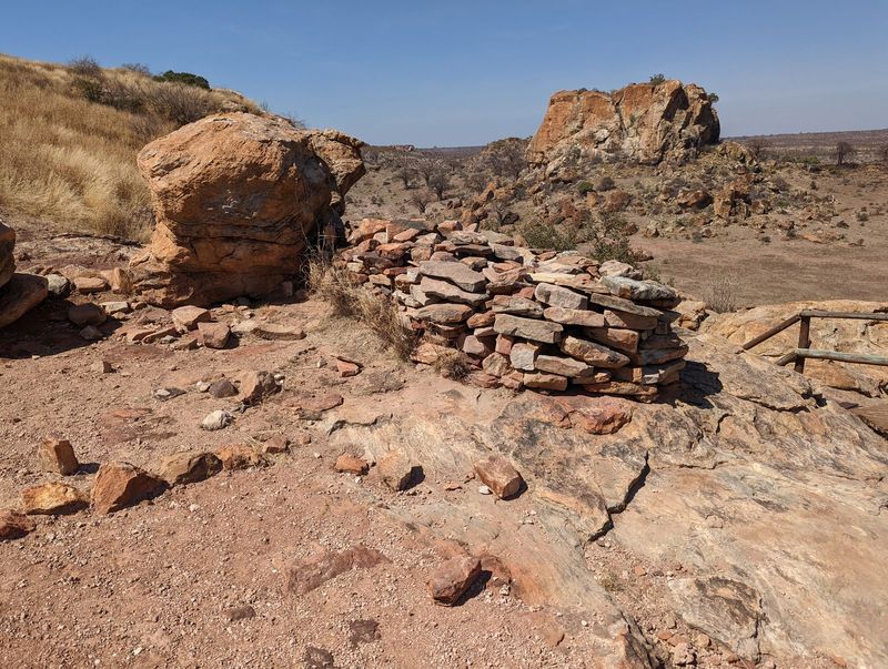 At the top of the stairs is a modest wall, unfortunately all we'll see of walls here, though "the people at Mapungubwe pioneered the famous 