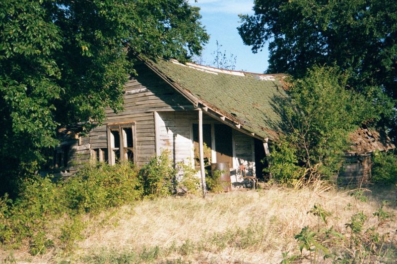 Tucked away on the same bit of ground, an old farmhouse survived until the commercial wave hit.