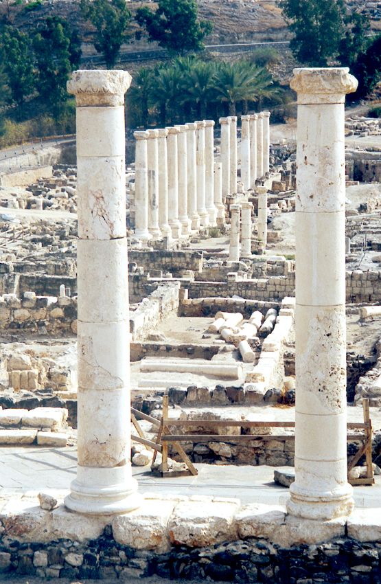 Looking east from the same vantage point, past two of four columns that were part of the Temple of Dionysus. The columns in the background w