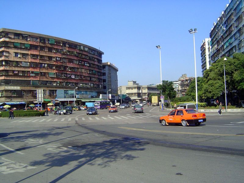 The waterfront curves inland here, and the road parallels it by turning toward the old Treaty Port town.
