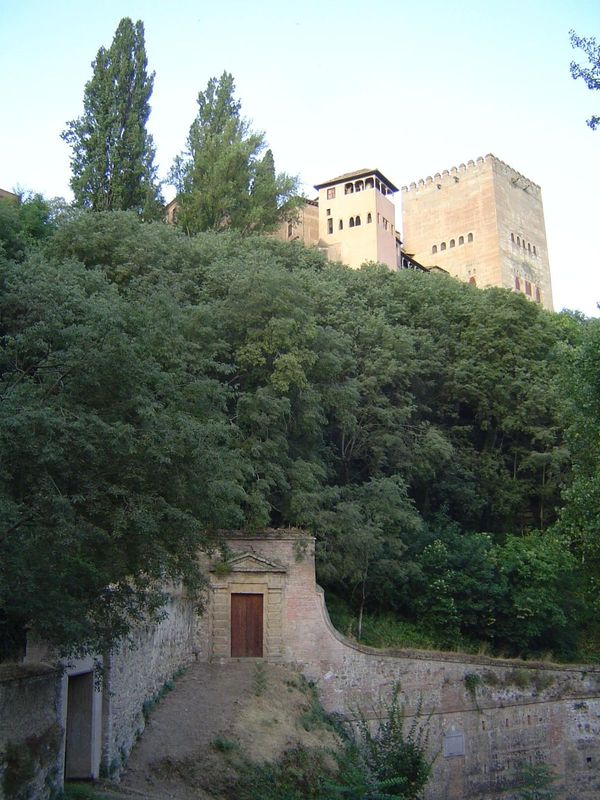 Looking up at the palaces from the slope at the foot of Lindaraja and the Tower of Comares. Numerous old entrances, like the one shown here,