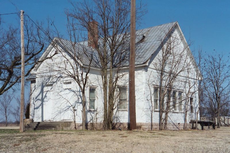 An abandoned but miraculously surviving schoolhouse at the north end of town.