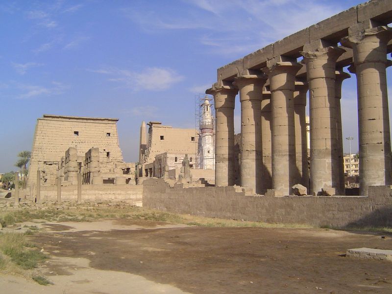 The colonnade is shown here together with the first courtyard and first pylon. A much more recent white mosque stands at the corner of the c