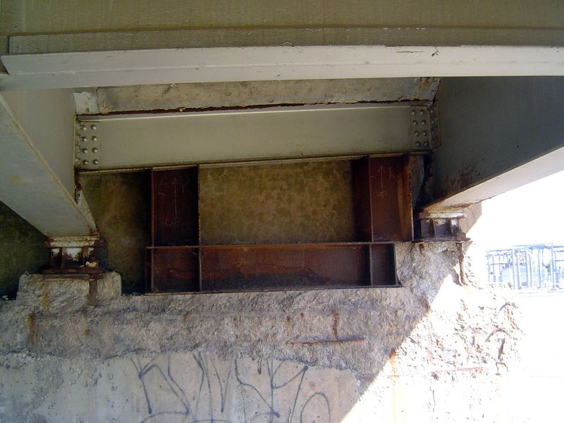 Here, along with crumbling concrete, some reinforcing has been placed under a crossbeam.