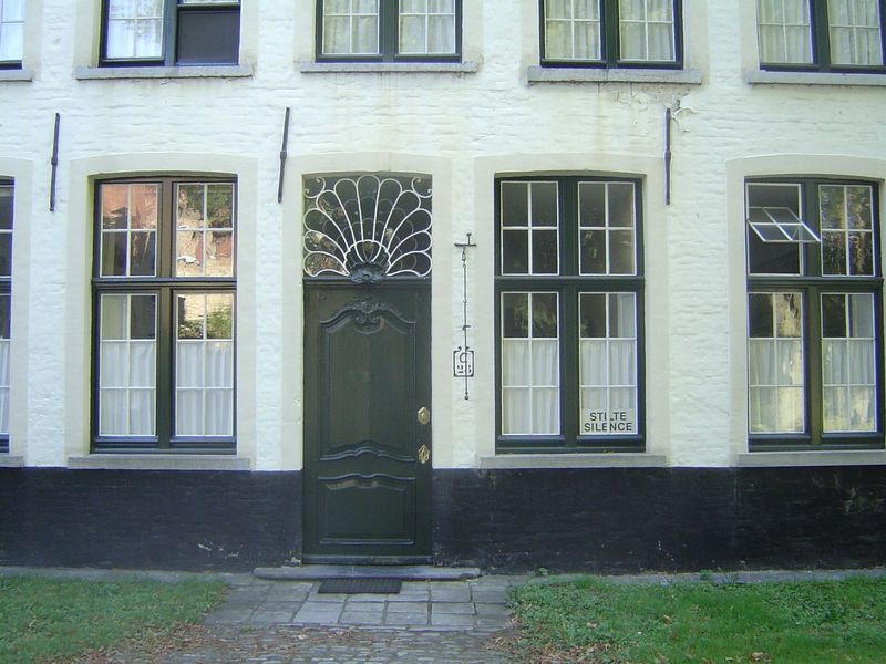 The "silence" is forbidding, but the window over the door is nice. The buildings themselves date from the 16th century; until 1900, when the