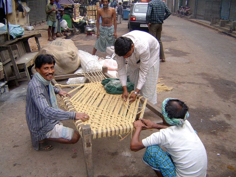 Weaving a charpoy.