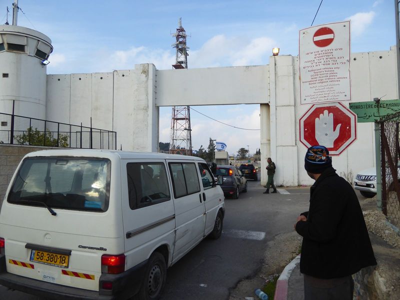 Here's the crossing point into Jerusalem. There are no checks coming the other way. The sign restricts traffic to authorized vehicles, defin