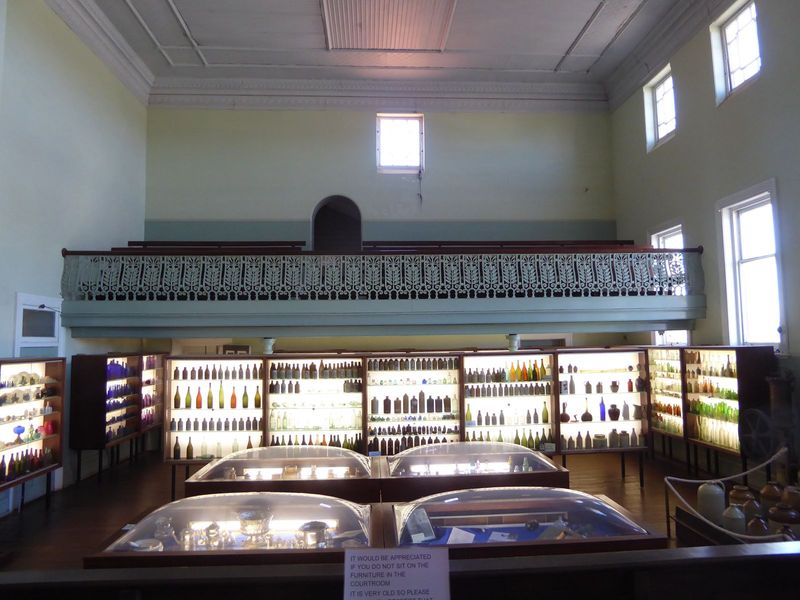 The view from the bench oversees a collection of pioneer-vintage bottles.