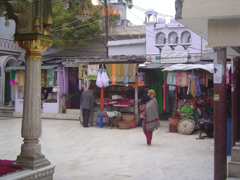 The pilgrims attract plenty of businesses, too. They not only line the lanes leading to the shrine but invade the shrine's enclosure.
