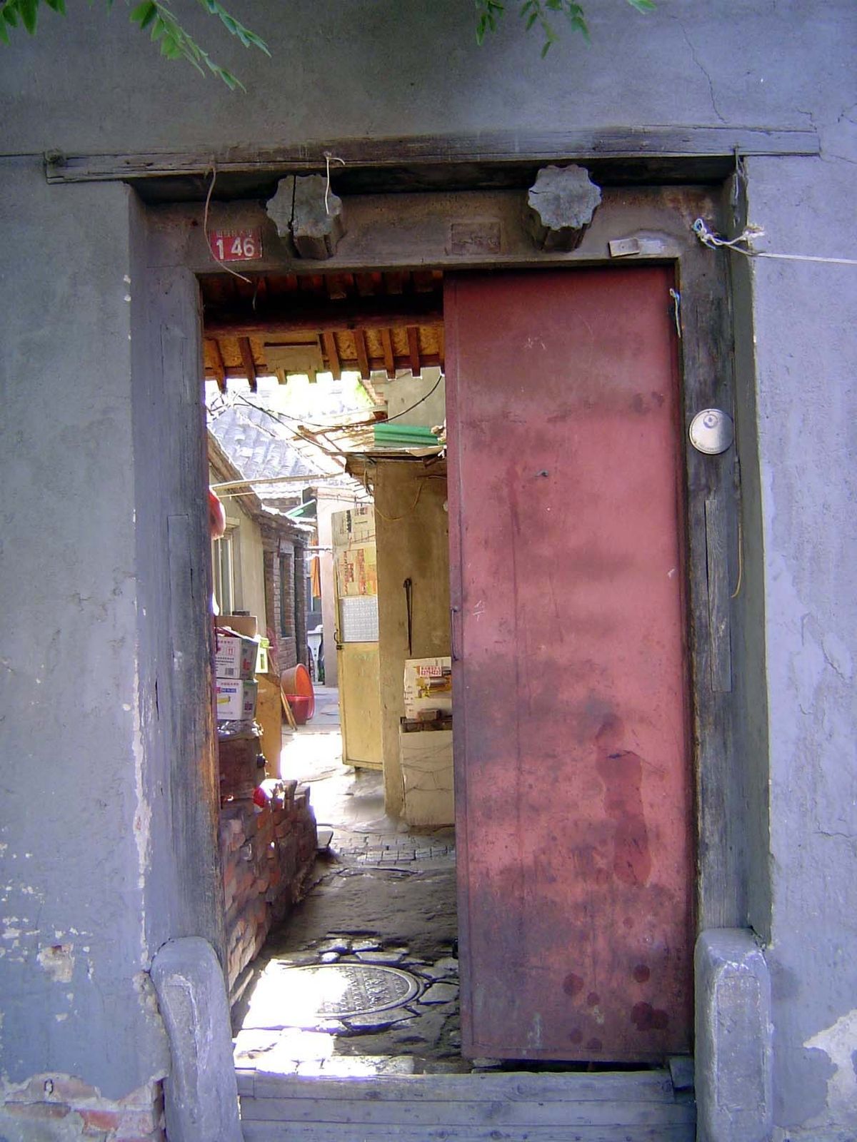 Inside this simple gate: many households.