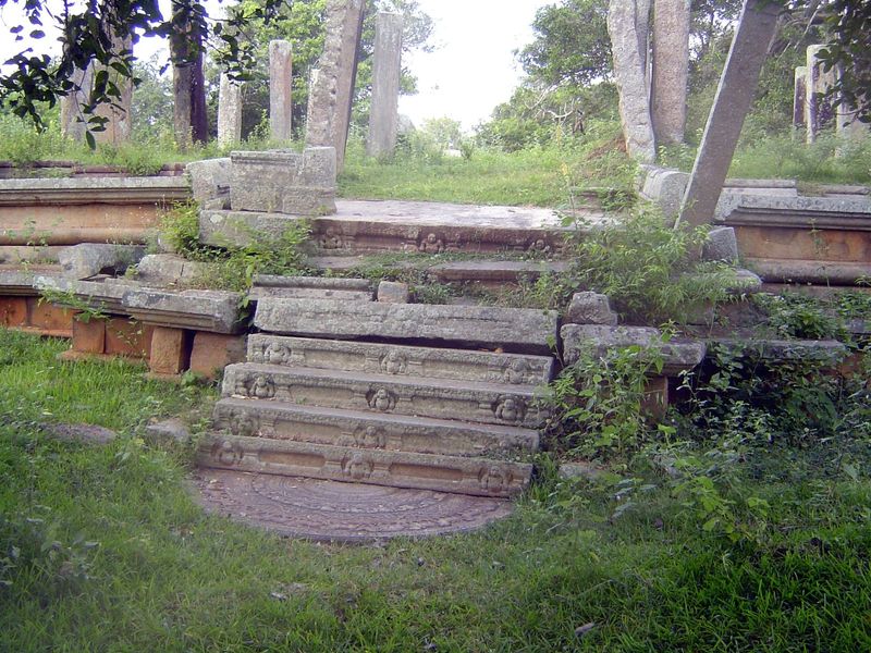 This is the ruin perhaps of a library, but it's called Mahasena's Palace. We're here for the half-circle stone at the bottom of the steps. I