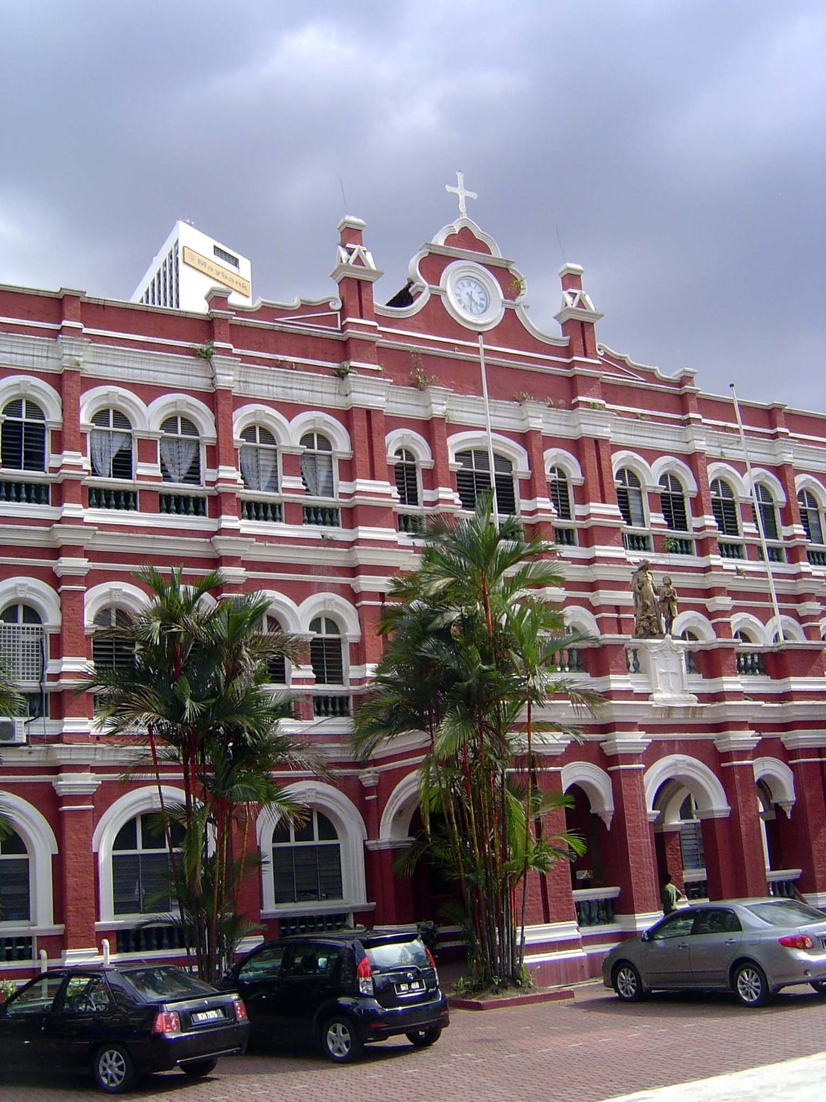 Church-affiliated English-medium schools arose, in this case St. John's Institution, a Catholic boy's school established in 1907.