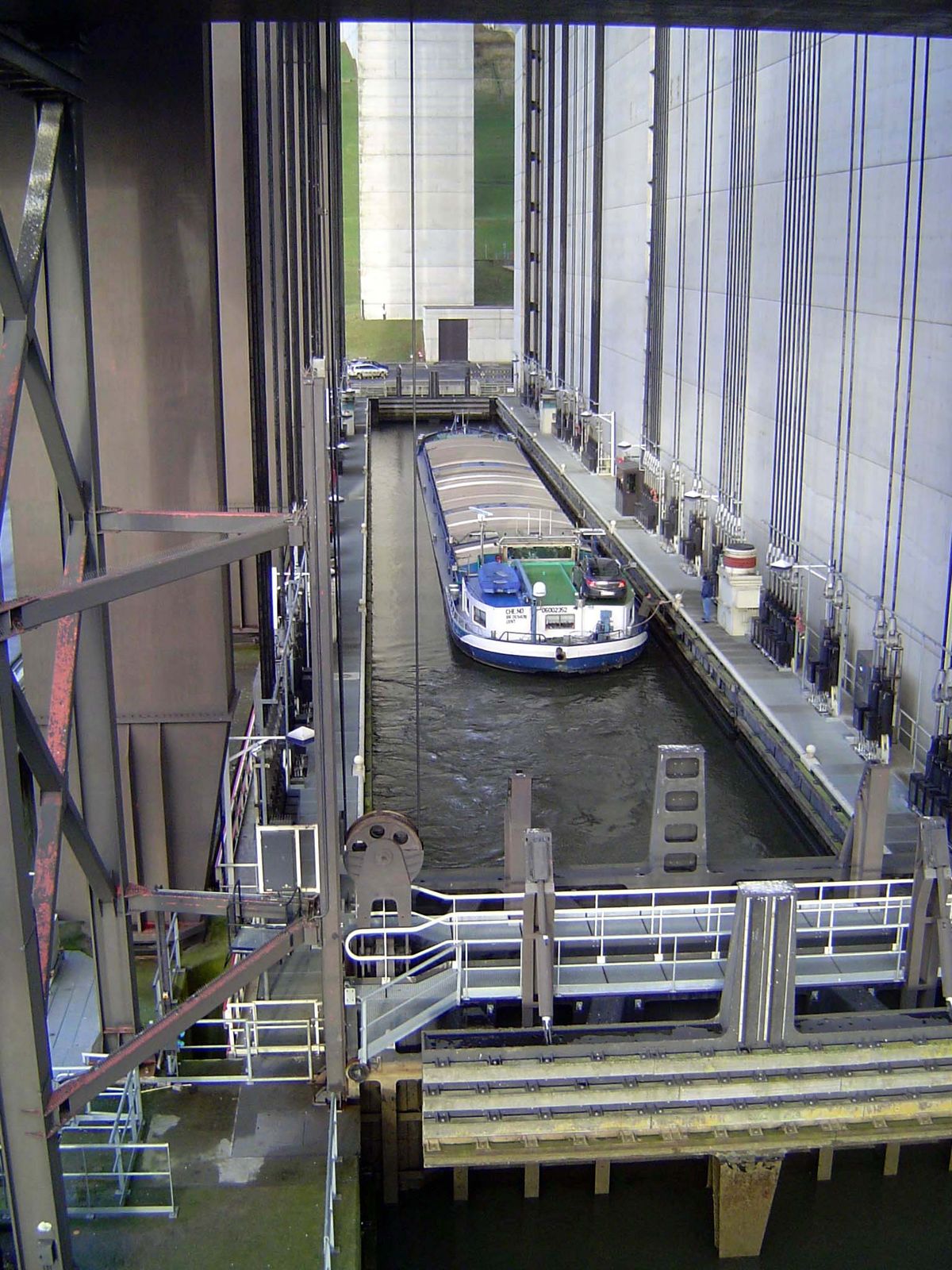 One enters the caisson. The water is four meters deep, and the caisson can handle barges of up to 112 meters in length and 12 meters in brea