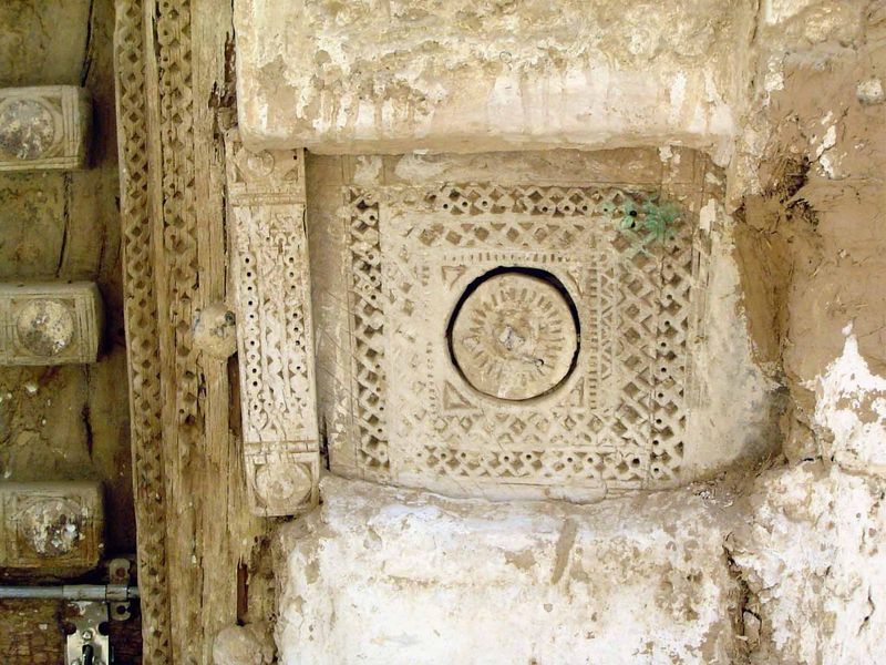 A finely carved door handle. Houses have no courtyards and only a single entrance.