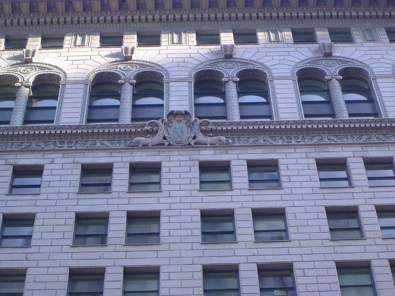A detail, with squid bracing the anchor logo.