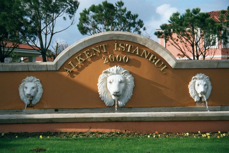 How about a gated community with a grand entranceway with genuine cast-stone lions?