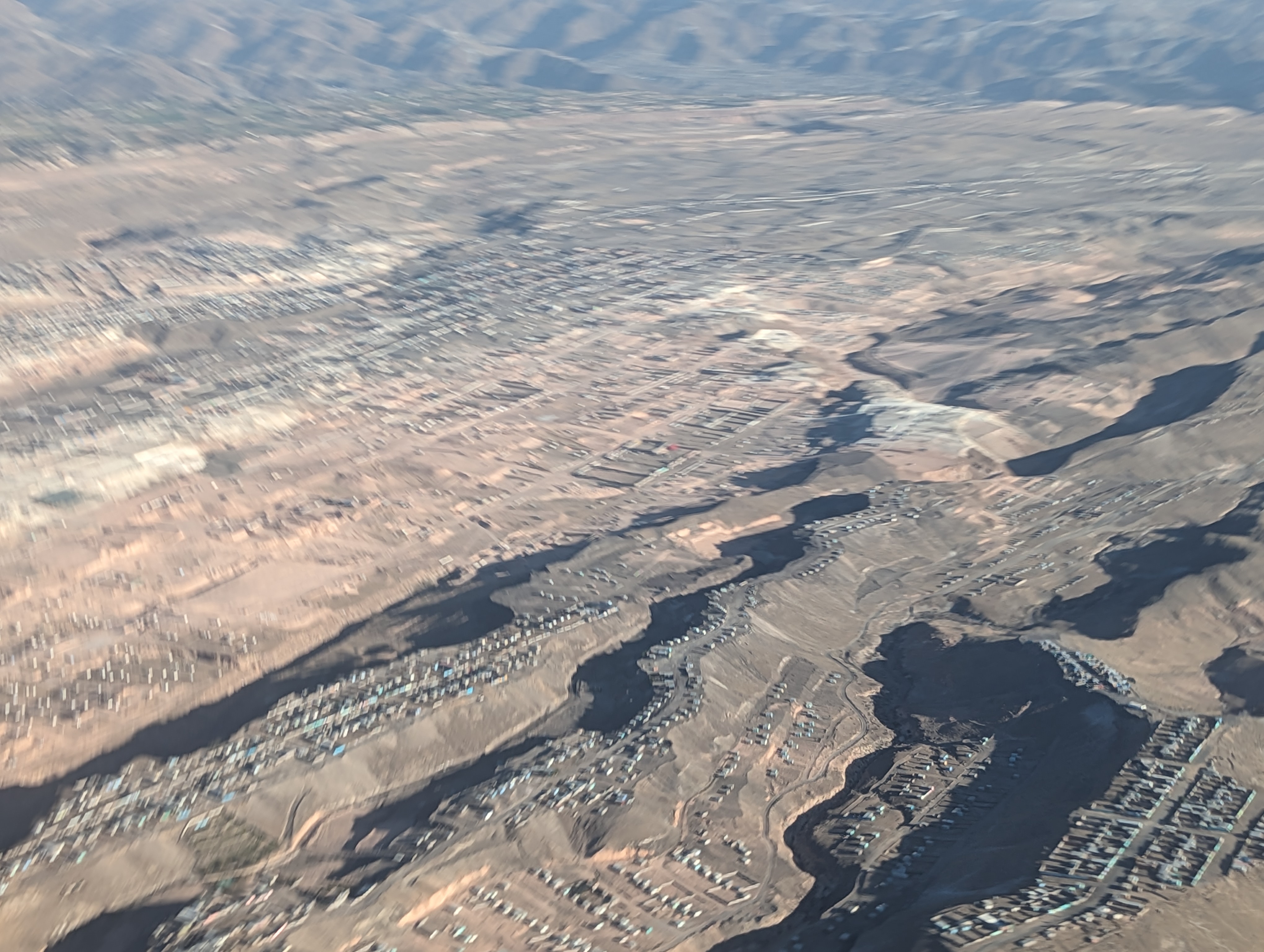 On the outskirts of the growing city of Arequipa, builders look for flat land.