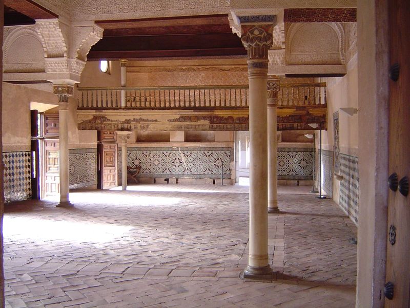 The Mexuar or council chamber became a chapel in the 1630s, when the wooden choir was added. In the background is an oratory.