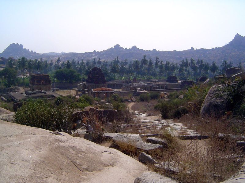 Over the pass, the view looks down on a desanctified temple named either for Tiruvengalanatha a form of Vishnu equivalent to Venkateshwar or