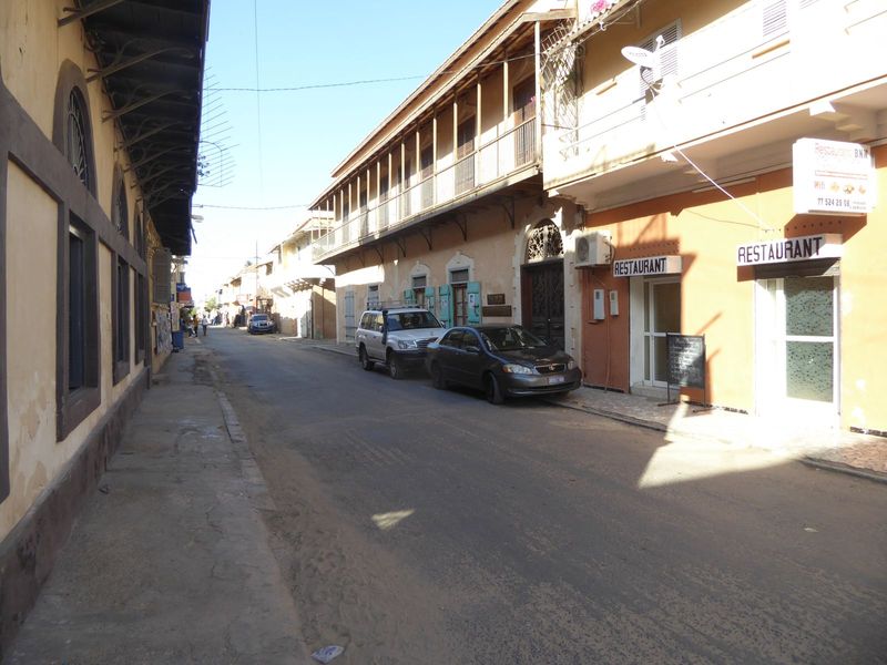 Without Bougainvillea, the streets can look pretty drab, despite the balconies. The building on the right and beyond the restaurant was a Mo