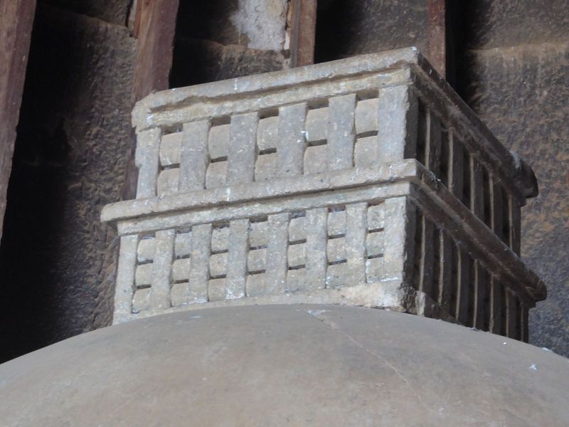 The box has the classic so-called Buddhist railing. Most of the dagoba is hewn from bedrock, but the upper box is not. Since we can't climb 
