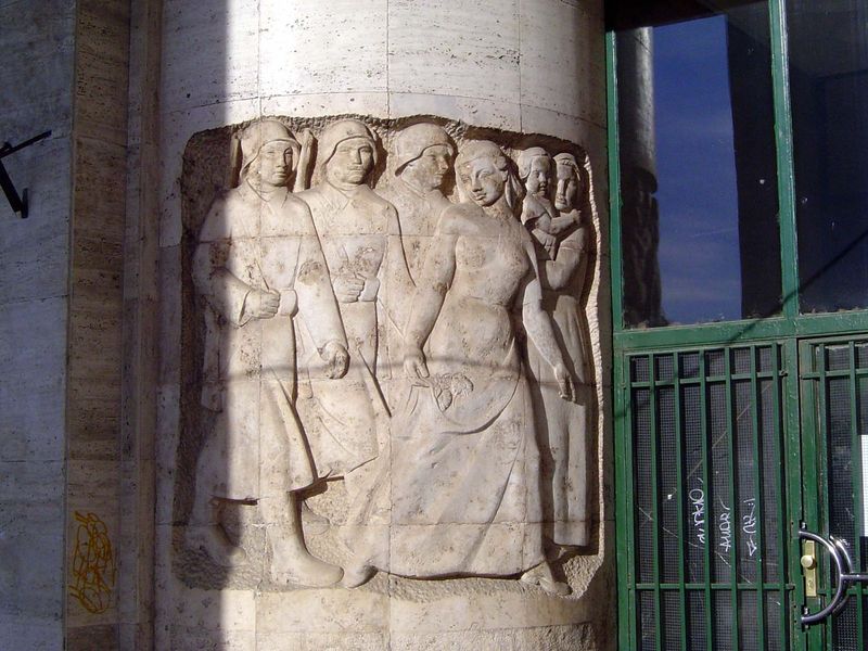 A relief on the wall of the building suggests a fondness for brute strength.