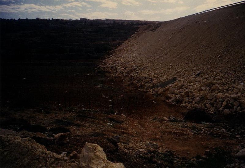 A few miles away from the site of the last picture, the Hebron bypass road passes atop fill dumped in a valley that had been solidly planted