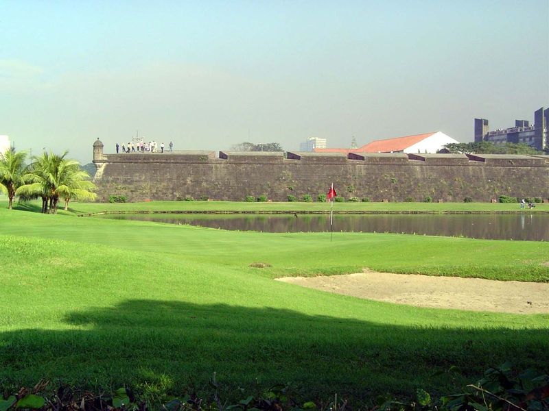 The most intact elements of the old city are its walls, fringed by an 18-hole golf course run by the Club Intramuros. The pond is not mere l